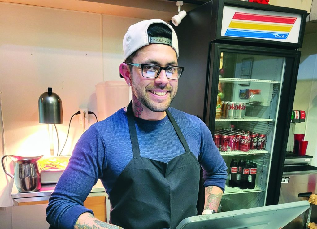 Jose Chavez, co-owner of Osito's, standing by the counter